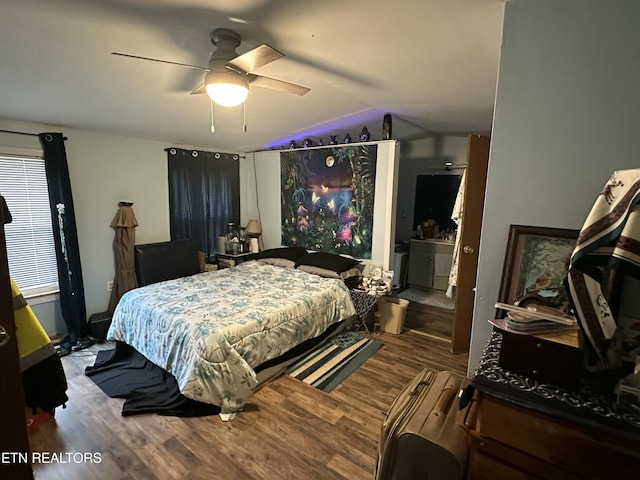 bedroom featuring wood finished floors, ceiling fan, and vaulted ceiling