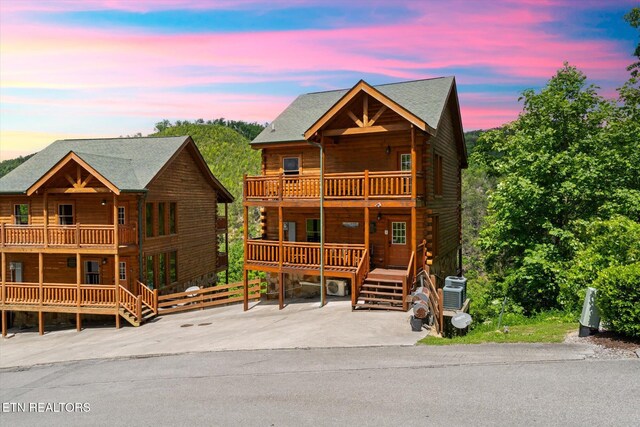 1230 Bird Nest Way, Sevierville, TN 37862 - log home featuring a balcony, a porch, and log exterior