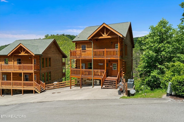 1230 Bird Nest Way, Sevierville, TN 37862 - log-style house featuring a balcony, a porch, and log siding