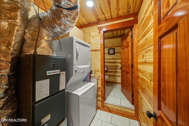 1230 Bird Nest Way, Sevierville, TN 37862 - laundry area with stacked washer / drying machine, wooden walls, wooden ceiling, and light tile patterned flooring