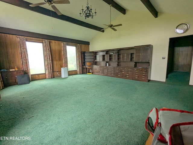 unfurnished living room with ceiling fan, vaulted ceiling with beams, and carpet floors