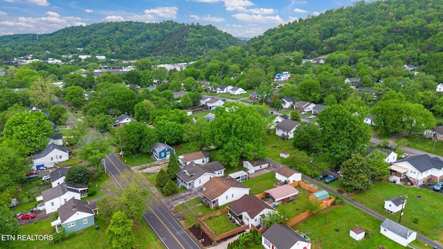 bird's eye view with a forest view and a residential view