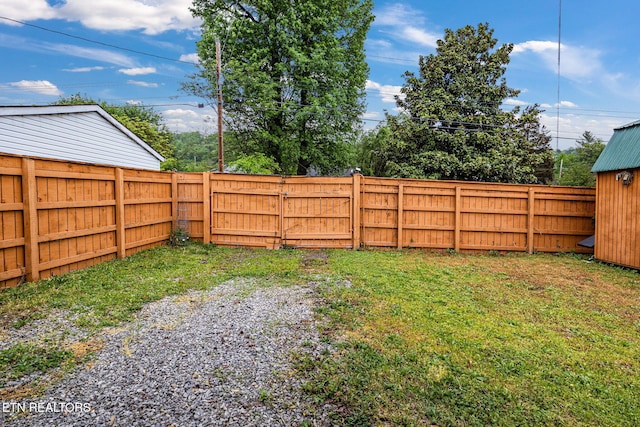 view of yard with a fenced backyard