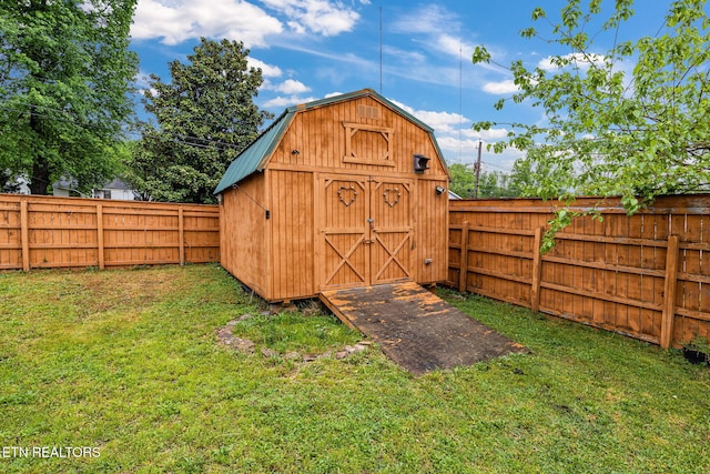 view of shed with a fenced backyard
