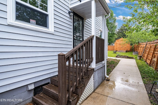 view of exterior entry with fence