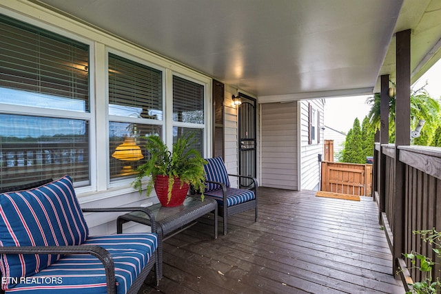 wooden terrace featuring a porch