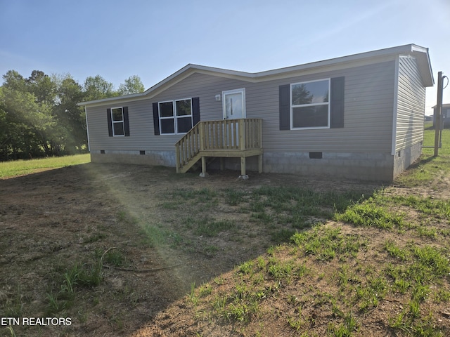 view of front of house featuring crawl space