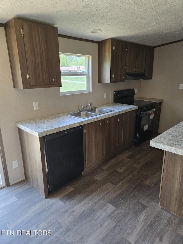 431 Mccroskey St, Englewood, TN 37329 - kitchen featuring electric range, a textured ceiling, dark wood finished floors, a sink, and light countertops