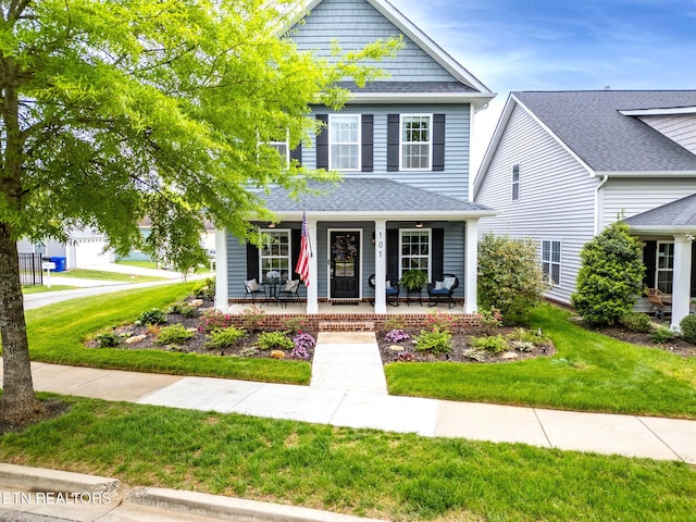 101 Fortenberry St, Oak Ridge, TN 37830 - view of front of home with a front yard, roof with shingles, and a porch