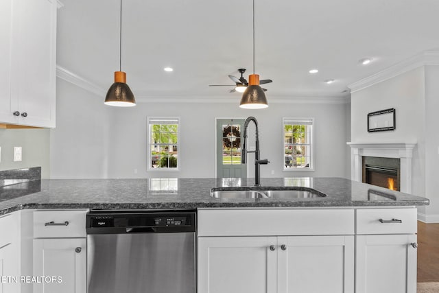 101 Fortenberry St, Oak Ridge, TN 37830 - kitchen featuring a sink, a warm lit fireplace, dark stone countertops, dishwasher, and white cabinets
