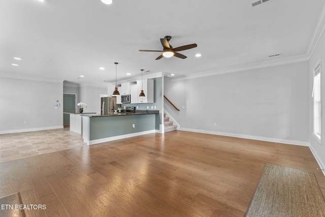 101 Fortenberry St, Oak Ridge, TN 37830 - unfurnished living room featuring recessed lighting, ceiling fan, light wood-style flooring, and baseboards