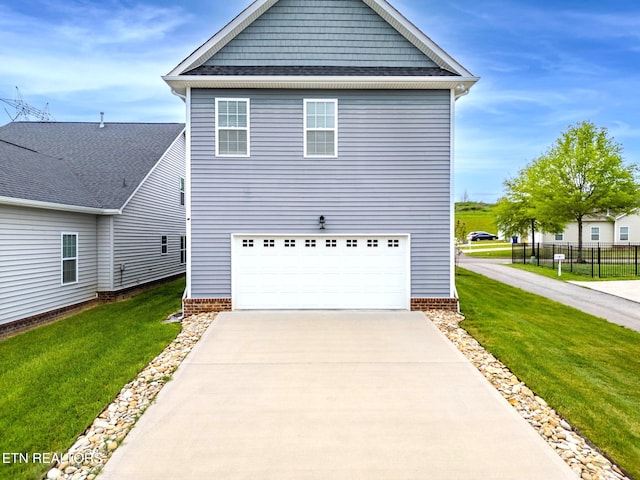 101 Fortenberry St, Oak Ridge, TN 37830 - view of front of house featuring a garage, fence, a front yard, and concrete driveway
