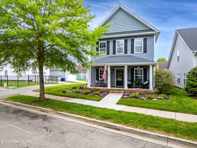 101 Fortenberry St, Oak Ridge, TN 37830 - view of front of property with a shingled roof, fence, a porch, and a front lawn