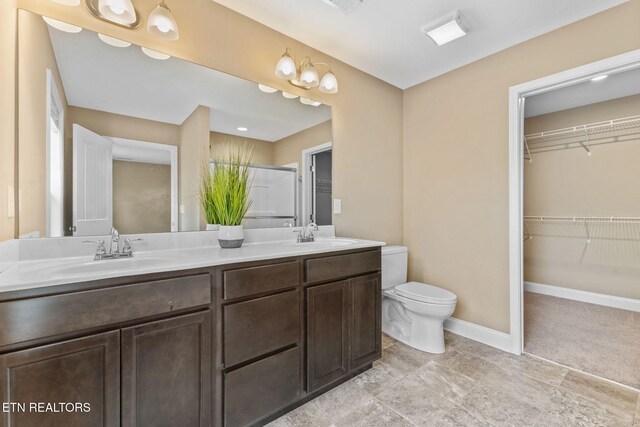 101 Fortenberry St, Oak Ridge, TN 37830 - bathroom with toilet, double vanity, a sink, and a spacious closet