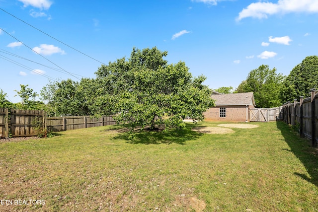 view of yard with a fenced backyard