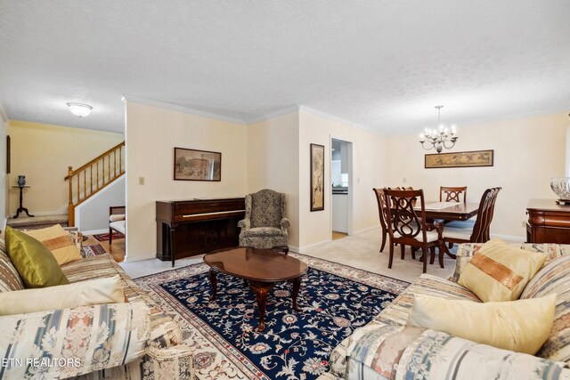 living area featuring a textured ceiling, a chandelier, baseboards, ornamental molding, and stairs