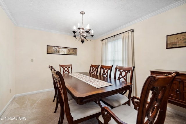 dining space with ornamental molding, baseboards, a notable chandelier, and light carpet