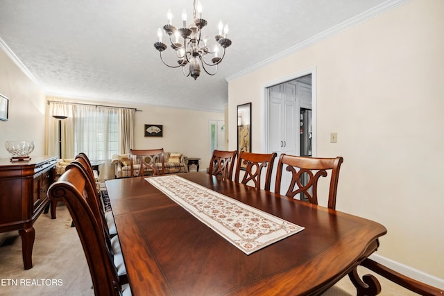 dining room with a textured ceiling, a chandelier, and crown molding