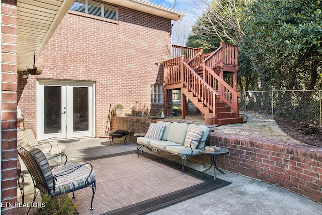 view of patio / terrace with fence, stairway, a deck, and french doors