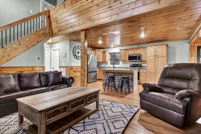 3131 Valley Home Rd, Sevierville, TN 37862 - living room with light wood-type flooring, stairs, and wooden ceiling