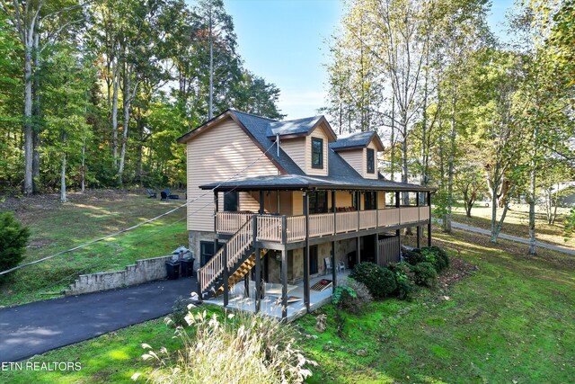 3131 Valley Home Rd, Sevierville, TN 37862 - rear view of house featuring a patio, stairs, a yard, asphalt driveway, and a wooden deck
