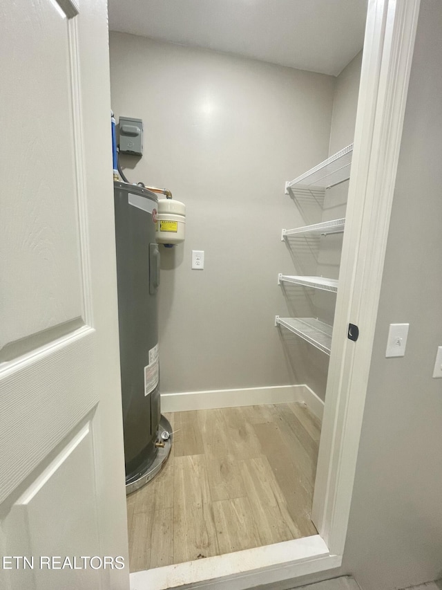 utility room with water heater