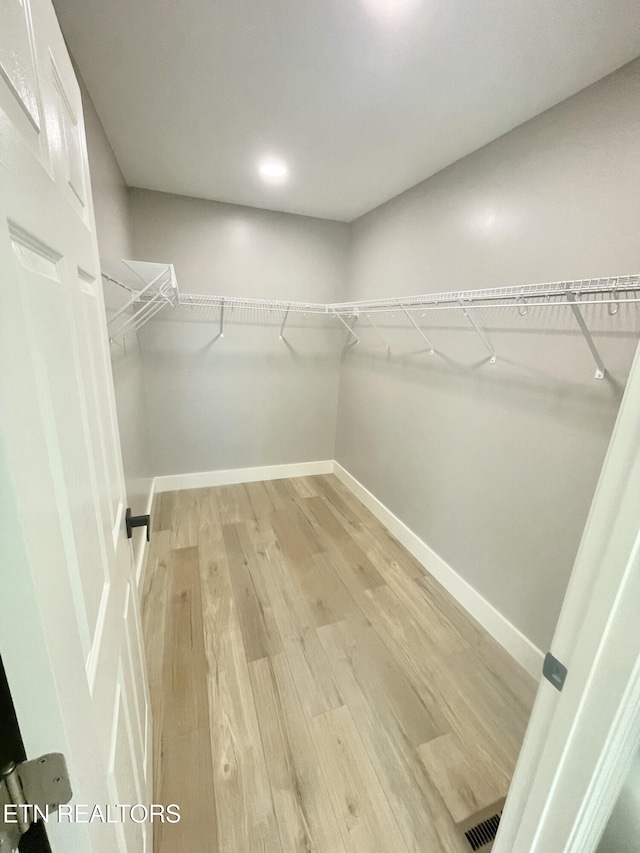 walk in closet with visible vents and light wood-style floors