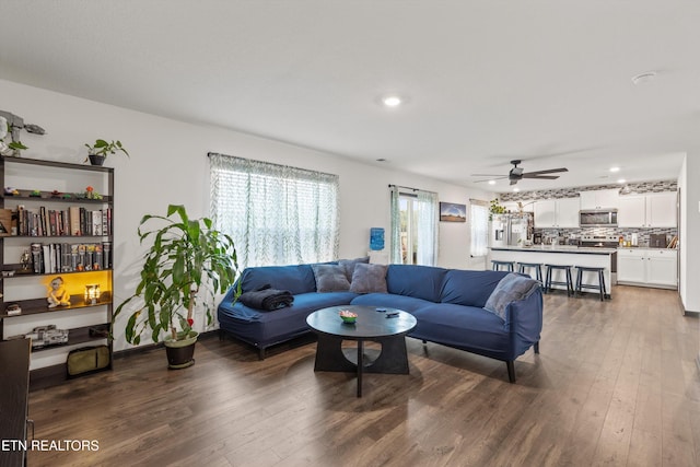 living room with wood-type flooring, recessed lighting, and ceiling fan