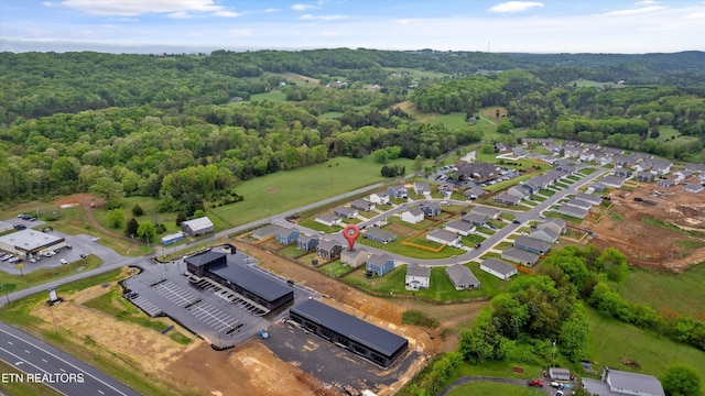 aerial view featuring a wooded view