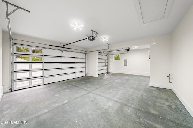 garage featuring baseboards and a garage door opener