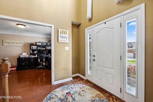 entryway featuring crown molding, dark wood-style floors, and a wealth of natural light