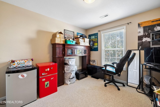 carpeted office featuring visible vents