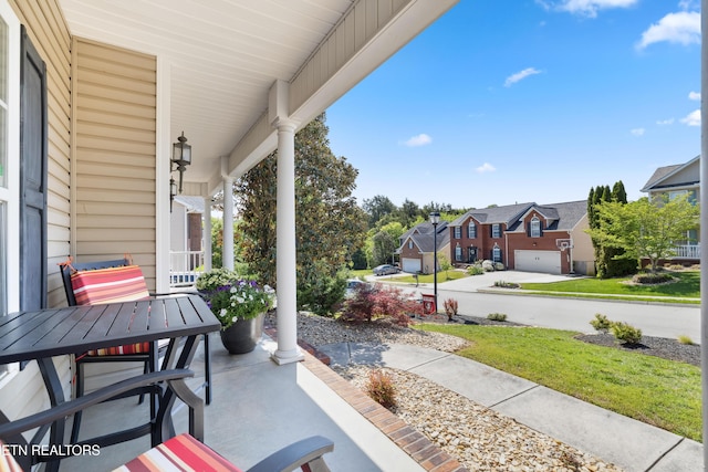 view of patio / terrace featuring a residential view and covered porch