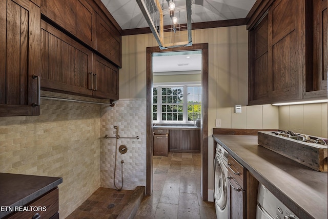 kitchen with washer / dryer and dark brown cabinets