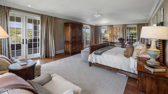bedroom featuring hardwood / wood-style flooring, crown molding, recessed lighting, french doors, and access to outside
