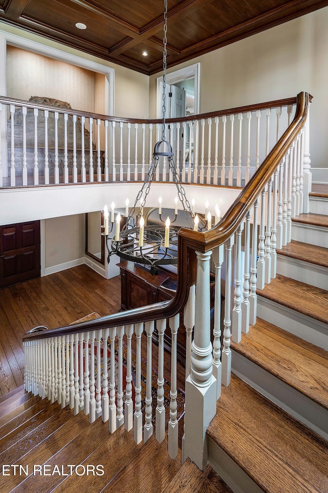 stairway with crown molding, hardwood / wood-style floors, coffered ceiling, baseboards, and recessed lighting