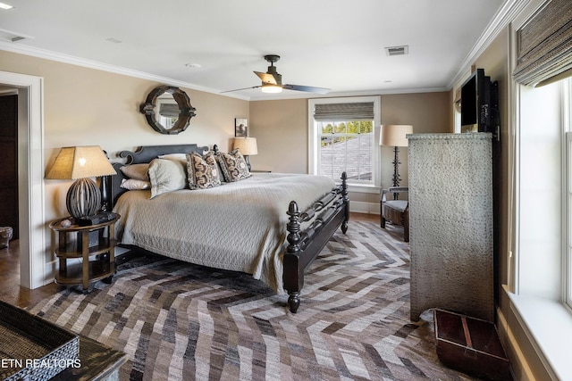 bedroom with visible vents, a ceiling fan, and ornamental molding