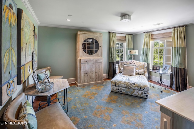 sitting room featuring visible vents, ornamental molding, and baseboards