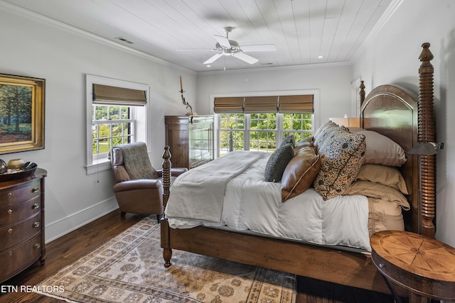 bedroom featuring wood finished floors, ceiling fan, baseboards, visible vents, and crown molding
