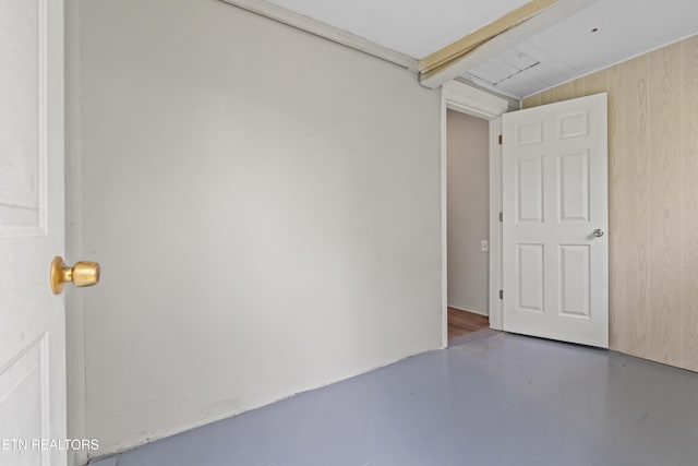spare room with concrete floors