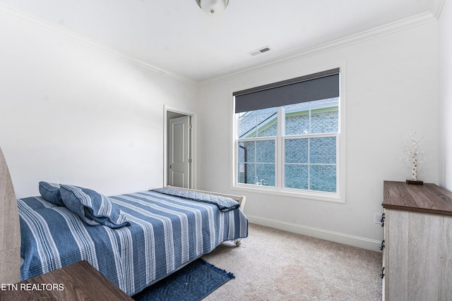 bedroom with visible vents, ornamental molding, carpet, and baseboards