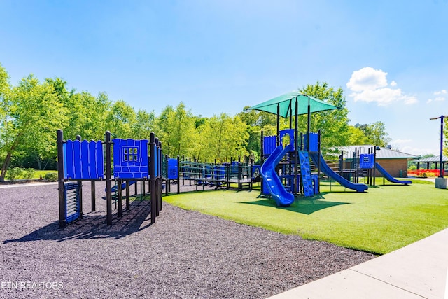 community play area with a lawn