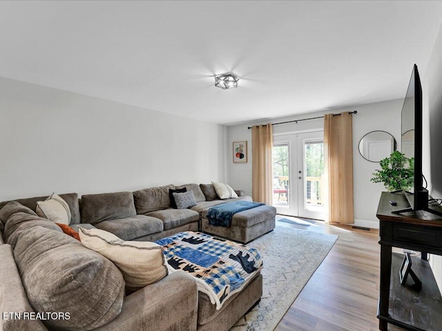 living area featuring light wood-style flooring
