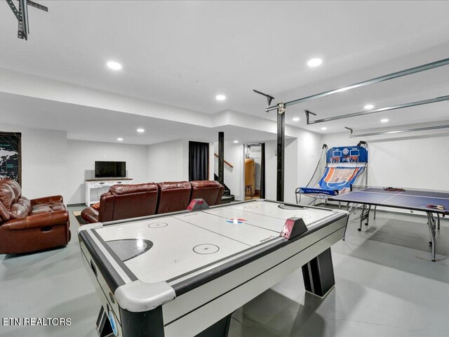 playroom featuring recessed lighting and finished concrete flooring