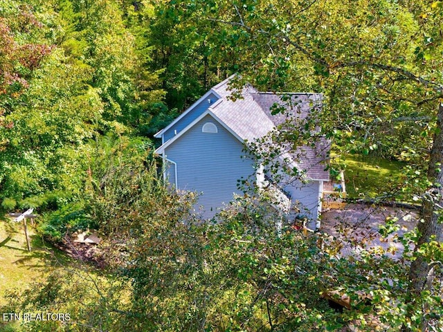 aerial view featuring a view of trees