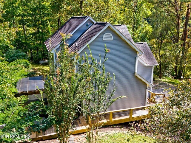 exterior space featuring a wooded view