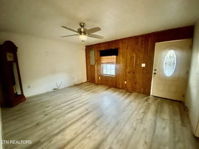 2789 Oak Grove Rd, Rocky Top, TN 37769 - interior space featuring wood walls, wood finished floors, ceiling fan, and arched walkways