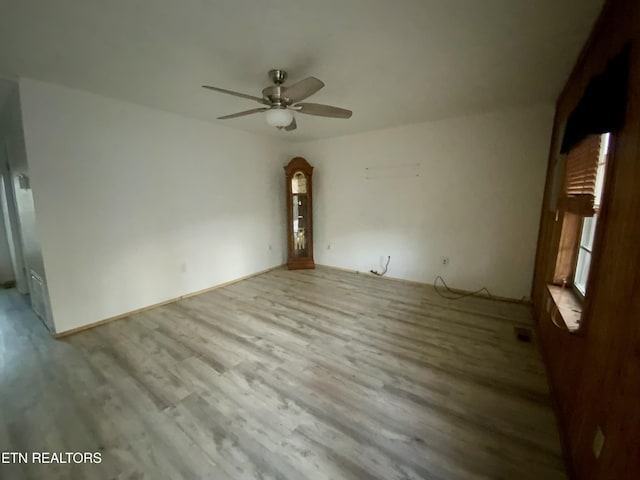 2789 Oak Grove Rd, Rocky Top, TN 37769 - empty room with a ceiling fan and wood finished floors