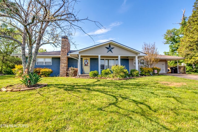 ranch-style home with a chimney, aphalt driveway, a front lawn, and a garage