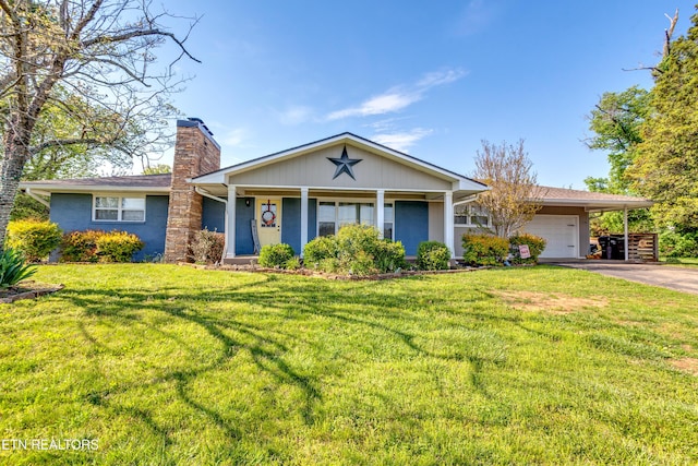 ranch-style home with a chimney, aphalt driveway, a front yard, and an attached garage